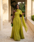 Sage Solace Evening Ruched Maxi Dress Sage Maxi Dress with Asymmetric silhouette and Textured texture, lifestyle scene image for Date Night, an estate dinner at golden hour, US East / Hamptons Elite by floravincie