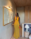 Mustard Yellow Gleam Evening Halter Maxi Dress Mustard Yellow Maxi Dress with Relaxed Fit silhouette and Textured texture, editorial ecommerce scene for Resort Wear, a polished coastal brunch, US East / Hamptons Elite by floravincie