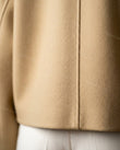Beige Jacket, close-up of wide high collar, double-breasted snap closure and dropped shoulders, by Floravincie