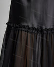 Black Maxi Ruffled Tiered Dress, close-up of sheer skirt overlay, tiered skirt and ruffled seam detail, by Floravincie
