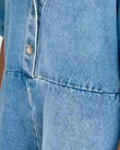 Light Blue Denim Jumpsuit, close-up of front button placket, collar and seamed waist, by Floravincie