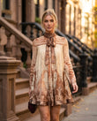 Cream Mini Ruffled Pleated Dress, three-quarter brand lifestyle view, by Floravincie
