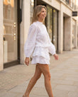 White Eyelet Ruffled Tiered Shorts Set, walking lifestyle view, by Floravincie