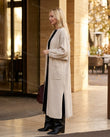 Light Beige Knit Cardigan, walking lifestyle view, by Floravincie