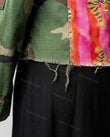 Green Jacket, close-up of brown and black accents, button-front closure and chest pockets with flaps, by Floravincie