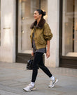 Olive Faux-Fur Ribbed Jacket, walking lifestyle view, by Floravincie