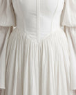 White Maxi Off-Shoulder Dress, close-up of off-the-shoulder design, corset-style bodice and gathered skirt, by Floravincie