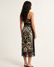 Black Floral Midi Cowl-Neck Dress, back studio view showing plain black with lace trim at hem, by Floravincie