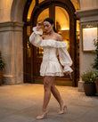 Off-white Mini Off-Shoulder Ruffled Dress, three-quarter brand lifestyle view, by Floravincie