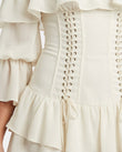 Off-white Mini Off-Shoulder Ruffled Dress, close-up of ruffles, lace-up detail and elasticated cuffs, by Floravincie