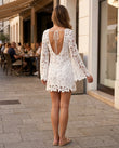 White Floral Mini Open-Back Dress, walking lifestyle view, by Floravincie